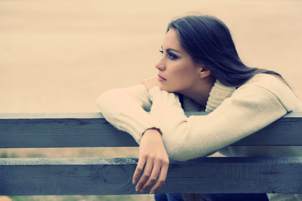 Young lonely woman on bench in park - https://depositphotos.com/photo/young-lonely-woman-on-bench-in-park-55207509.html